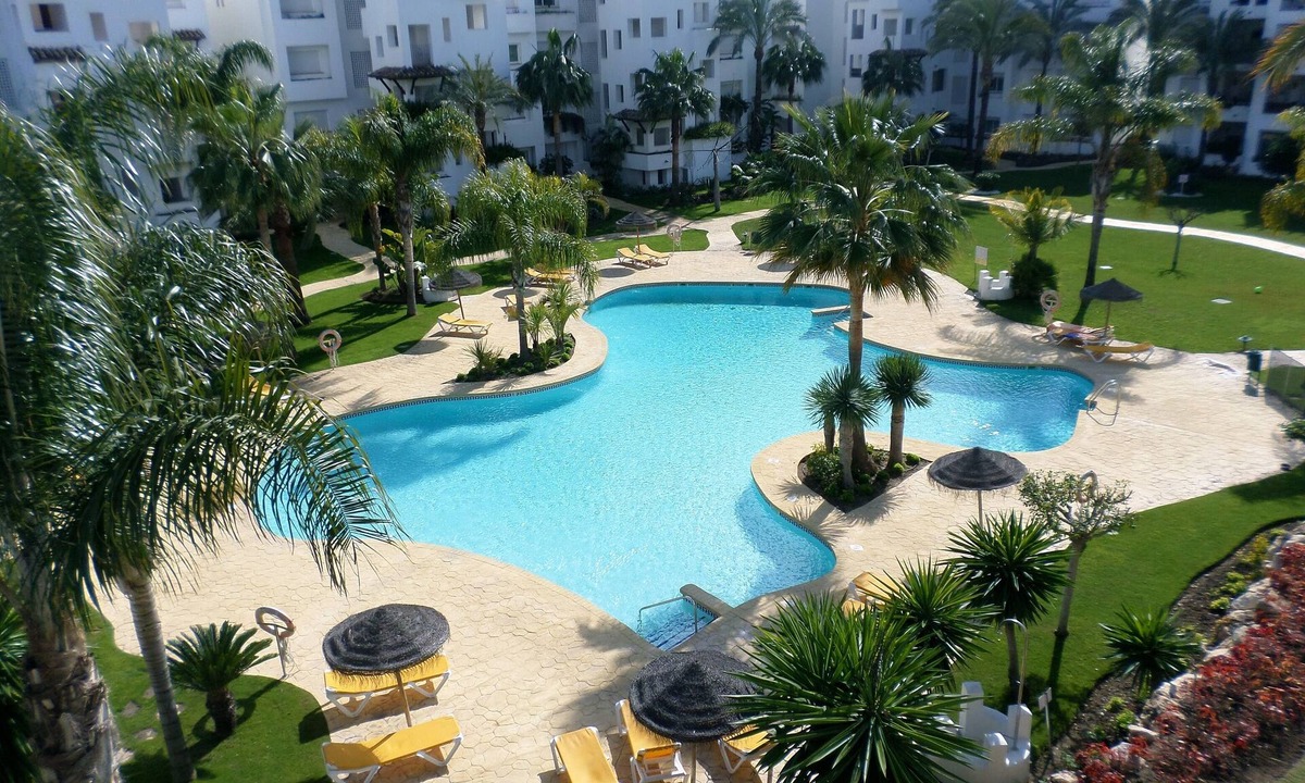 New Golden Mile Apartment | 2 Bedroom Beachside Apartment Overlooking Pool & Palm Trees On New Golden Mile