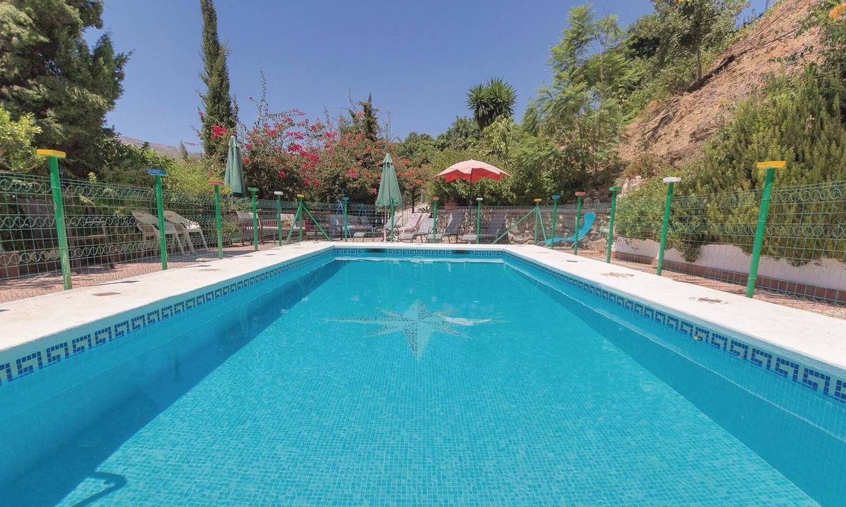 Totalan House | Surrounded by trees in a very private environment is this typical Andalusian house, renovated in the