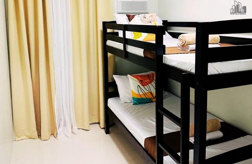 Puerto Princesa City Centre Apartment | 2-Bedroom Puerto Princesa to unwind at rentals near PPC Airport, FREE Pool, FREE Parking - B2 5Luster