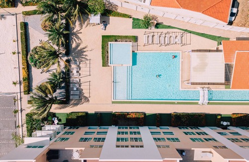 Turibana Condo | Beach Tennis Court And Resort Pool