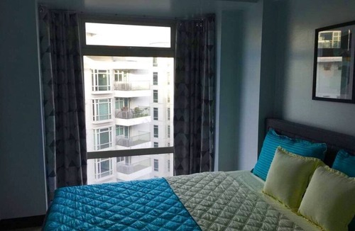 Pasay Condo | CF10C The Parkside Villas, Family room with kichen, dining,living area & balcony