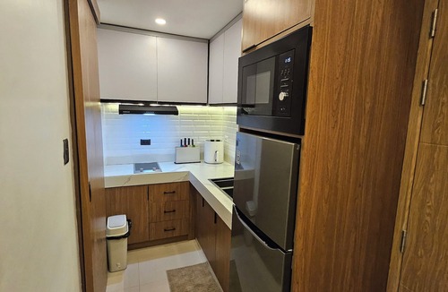 Paranaque Apartment | Luxury apartment at Bloom Residences with Balcony overlooking pool near NAIA/BGC