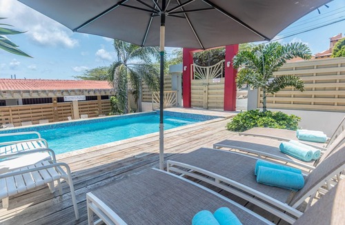 Boegoeroei Apartment | Sunny Pool Haven in the Heart of Aruba ~ Pool~BBQ