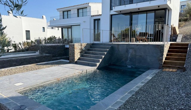 Architect-designed villa - 4 waterfront suites with private pool