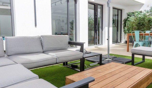 Ground floor with private patio next to the beach