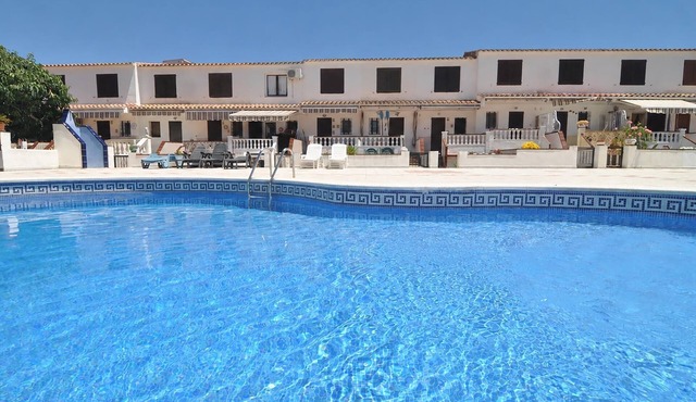 House with community pool and car parking