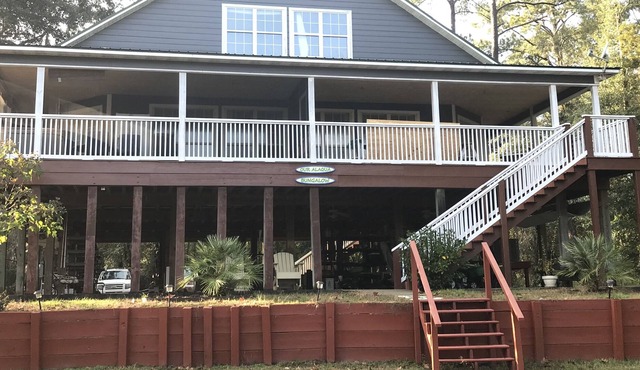 Secluded Waterfront with deep water dock, trailer parking, and public boat ramp